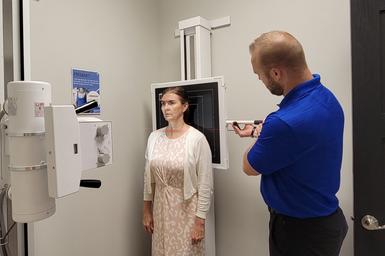 Chiropractor Shane Davidson with Patient at Novo Chiropractic Lincoln clinic